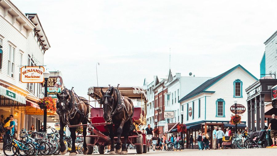 A horse-drawn carriage on the car-free main street of Mackinac Island