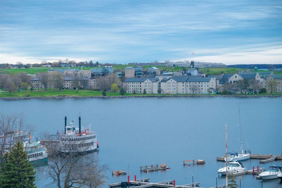 Kingston, Ontario harbor with a sternwheel boat and marina below the old city