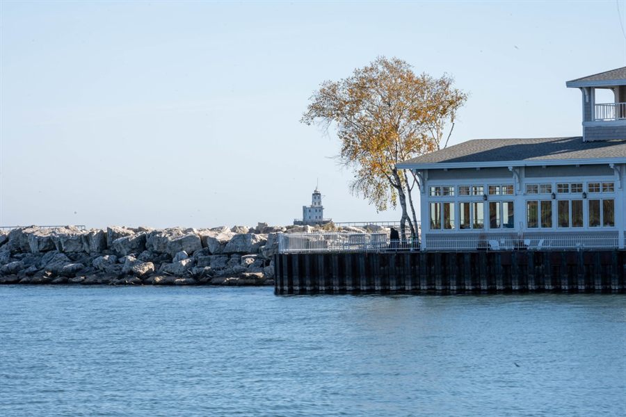 Breakwater lighthouse and a lakefront building on Lake Michigan at Milwaukee
